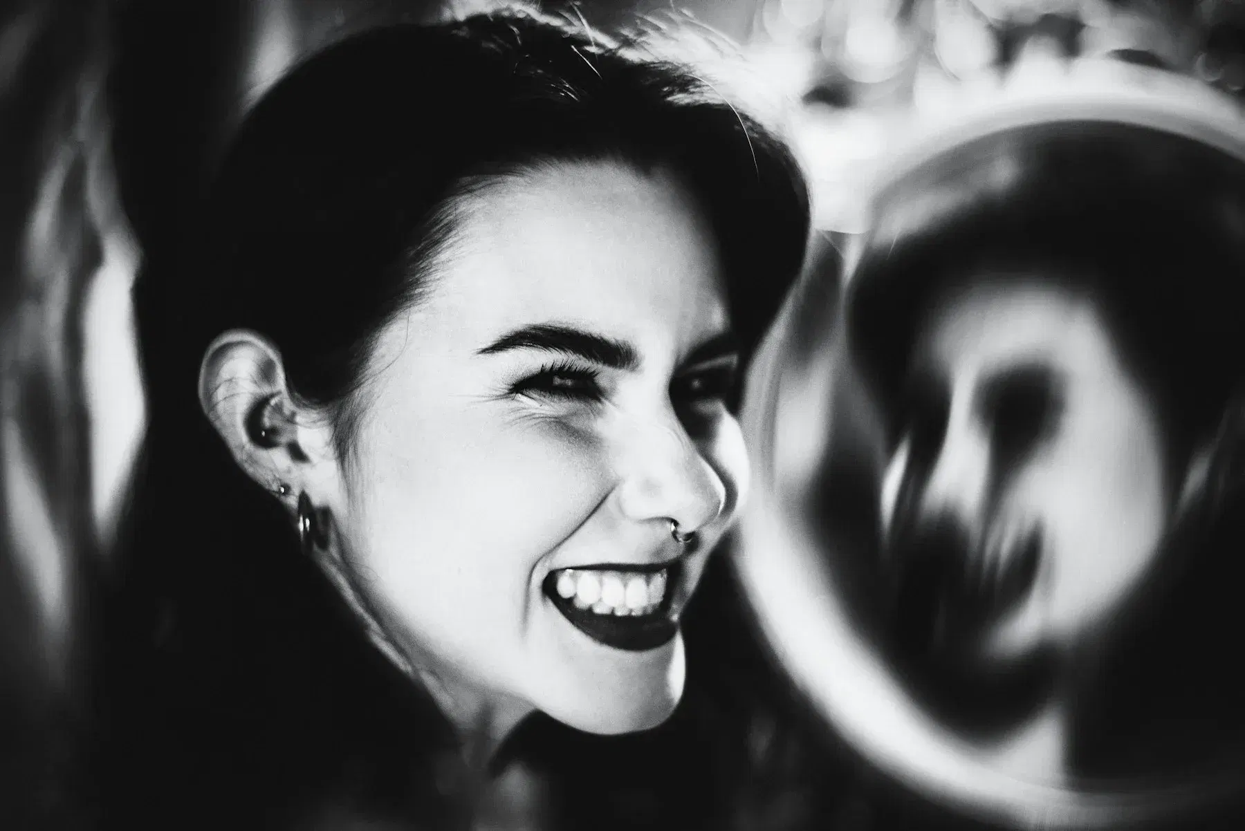 Smiling woman in dramatic monochrome light