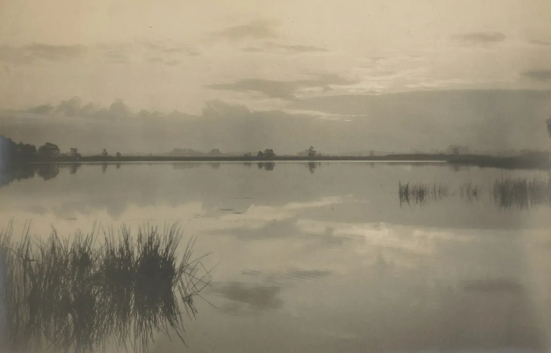 Historic photograph of clouds reflected in quiet water